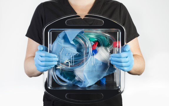 ECLS Priming Tray held by a Person in Black Scrubs