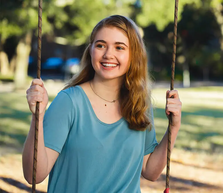 Young girl on a swing