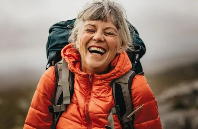 Smiling woman wearing backpack